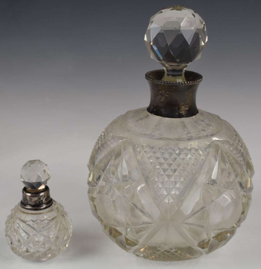 Two hallmarked silver mounted scent bottles, larger Birmingham 1904, maker's mark indistinct, likely