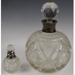Two hallmarked silver mounted scent bottles, larger Birmingham 1904, maker's mark indistinct, likely