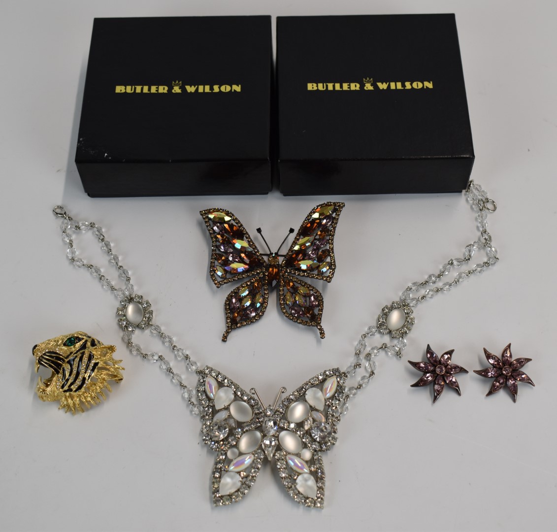 Four Butler and Wilson pieces comprising butterfly necklace, tiger brooch with enamel decoration,