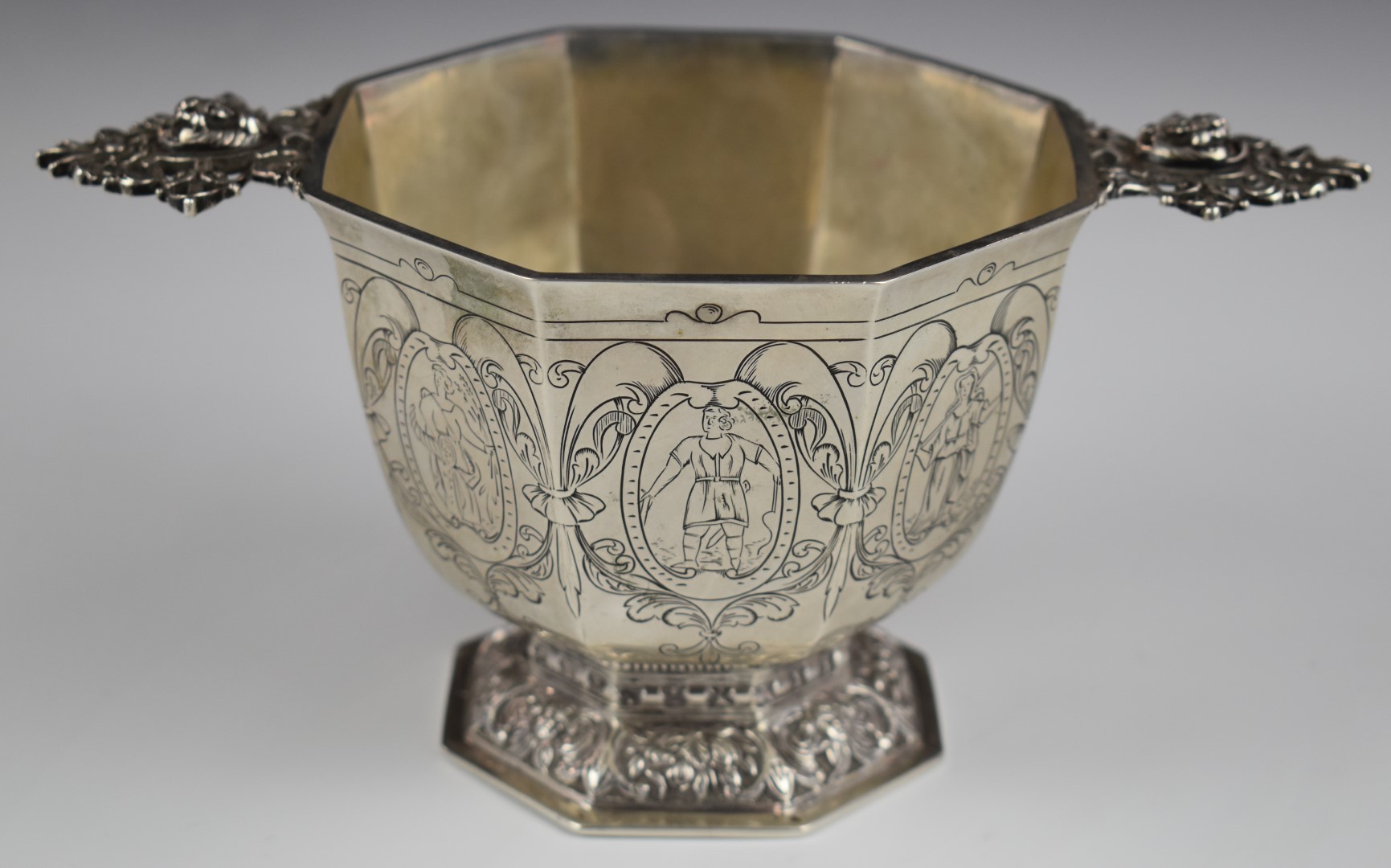 Dutch silver twin handled octagonal bowl with engraved decoration of figures and Dutch silver