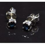 A pair of 14k white gold earrings set with a sapphire approximately 0.2cts to each, 1.4g