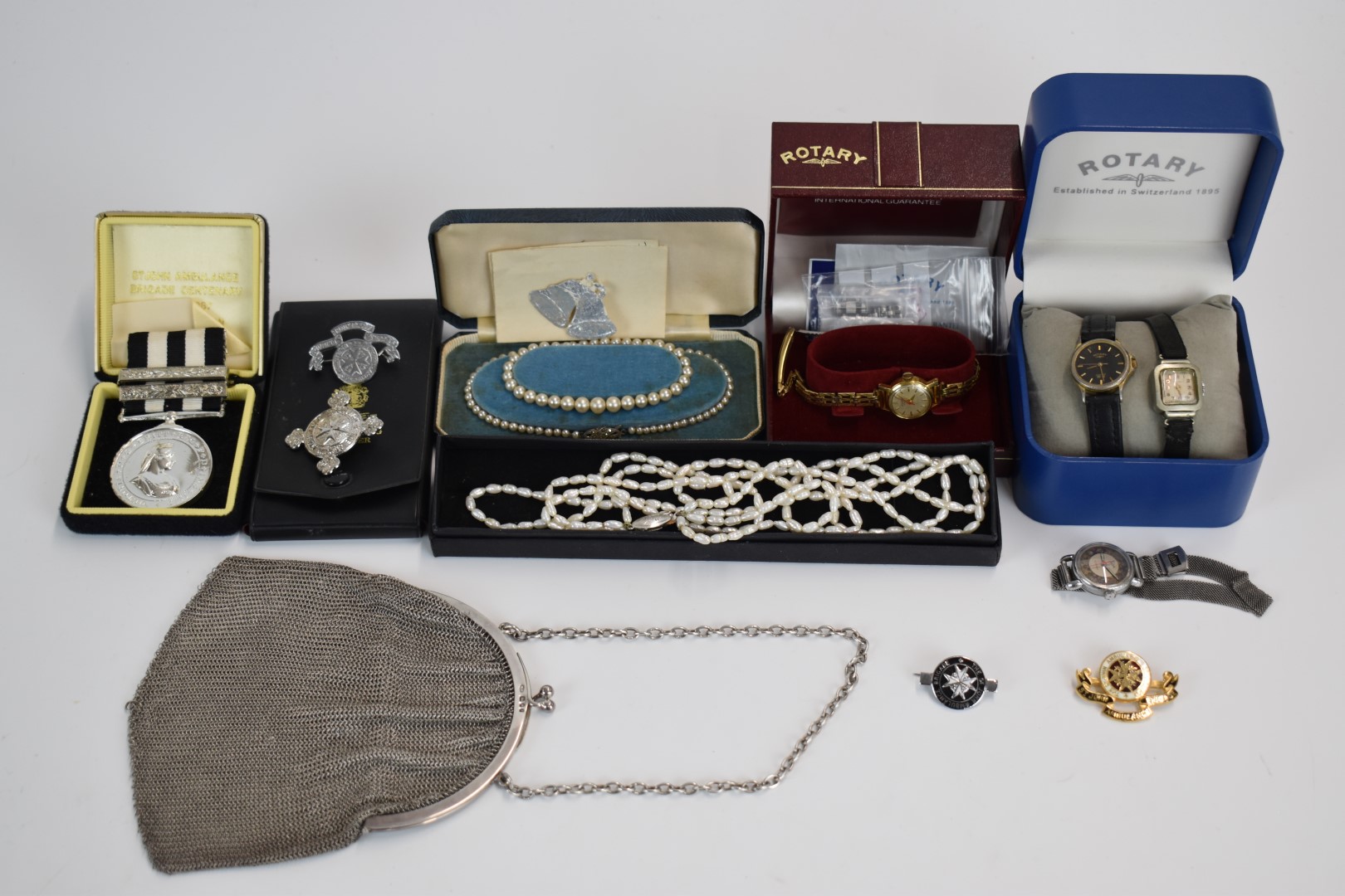 A collection of costume jewellery including silver purse, pearl necklace etc