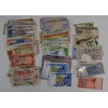 A collection of world banknotes, largely Asian and some Middle Eastern, includes £160 of Iranian