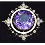 Edwardian 9ct gold brooch set with a round cut amethyst and seed pearls, 5.1g