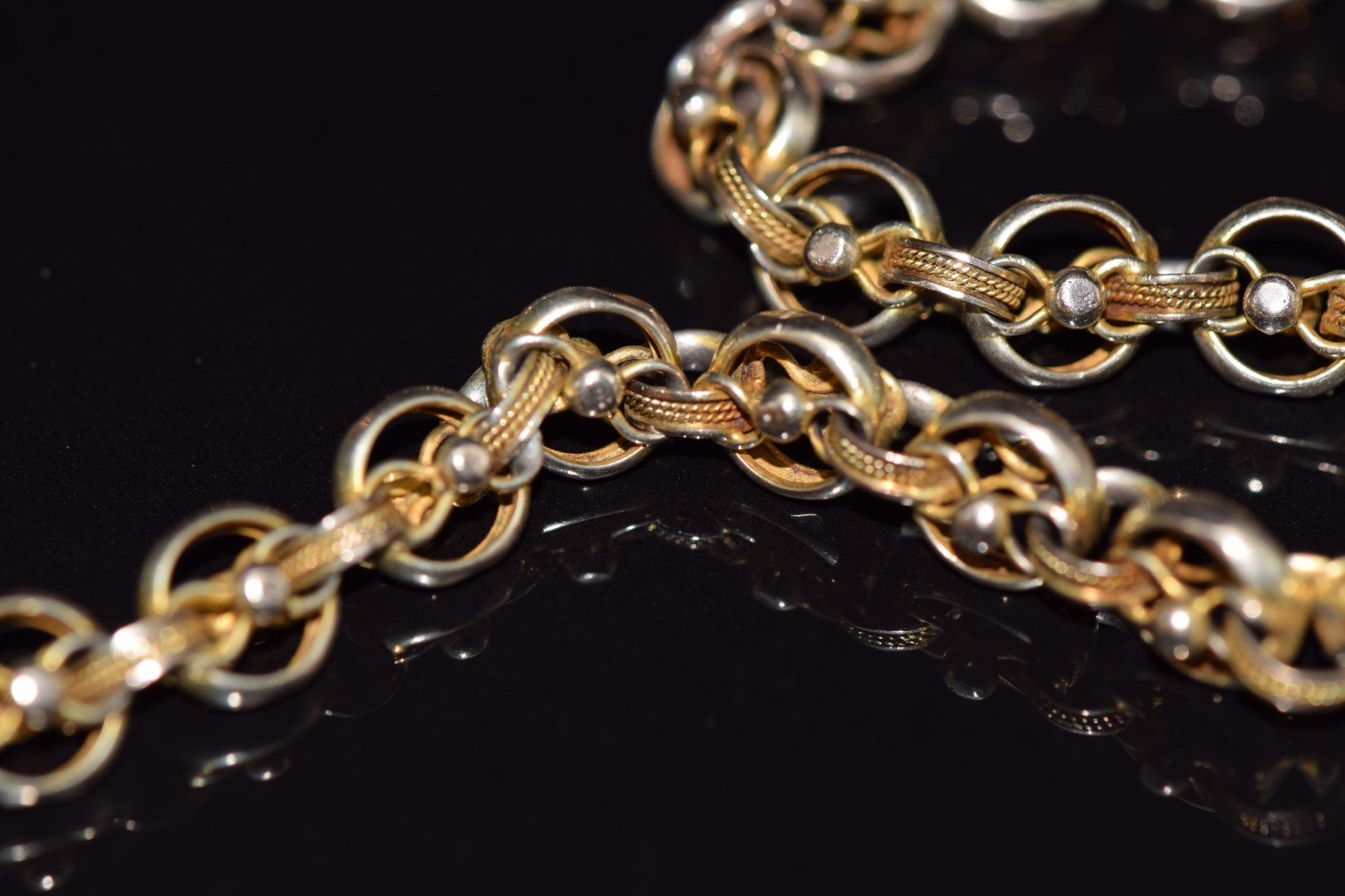 Victorian yellow metal Albert/ fob chain made up of faceted and rope decorated links, 32.2g - Image 2 of 2