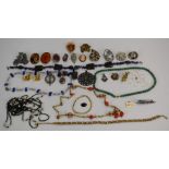 A collection of costume jewellery including beads, amethyst necklace, Victorian locket, Miracle