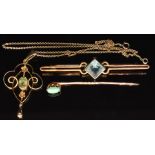 Edwardian 9ct gold pendant set with a peridot on 9ct gold chain, a 9ct gold stick pin set with a