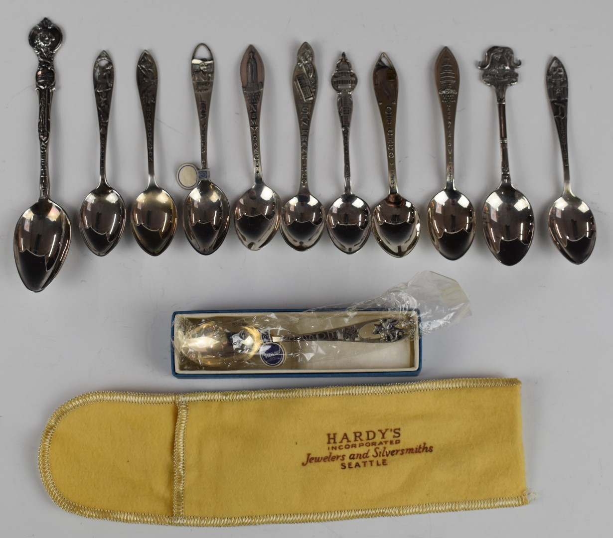 Twelve American silver souvenir spoons to include San Francisco, Las Vegas, Grand Canyon and