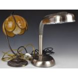 Two table lamps, one stainless steel and the other with and orange tulip shade, tallest 37cm