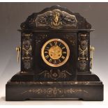 French marble cased mantel clock with classical figures to either side, cherubs, Grecian vase and