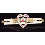 A c1910 9ct gold brooch in the form of a heart set with seed pearls and paste, 2.6g