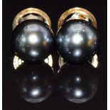 A pair of 9ct gold earrings set with a Tahitian pearl to each, 6.9g