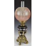 19thC oil lamp with ornate brass stand and glass shade, H59cm