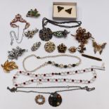 A collection of costume jewellery including Miracle pendants, vintage brooches, silver heart