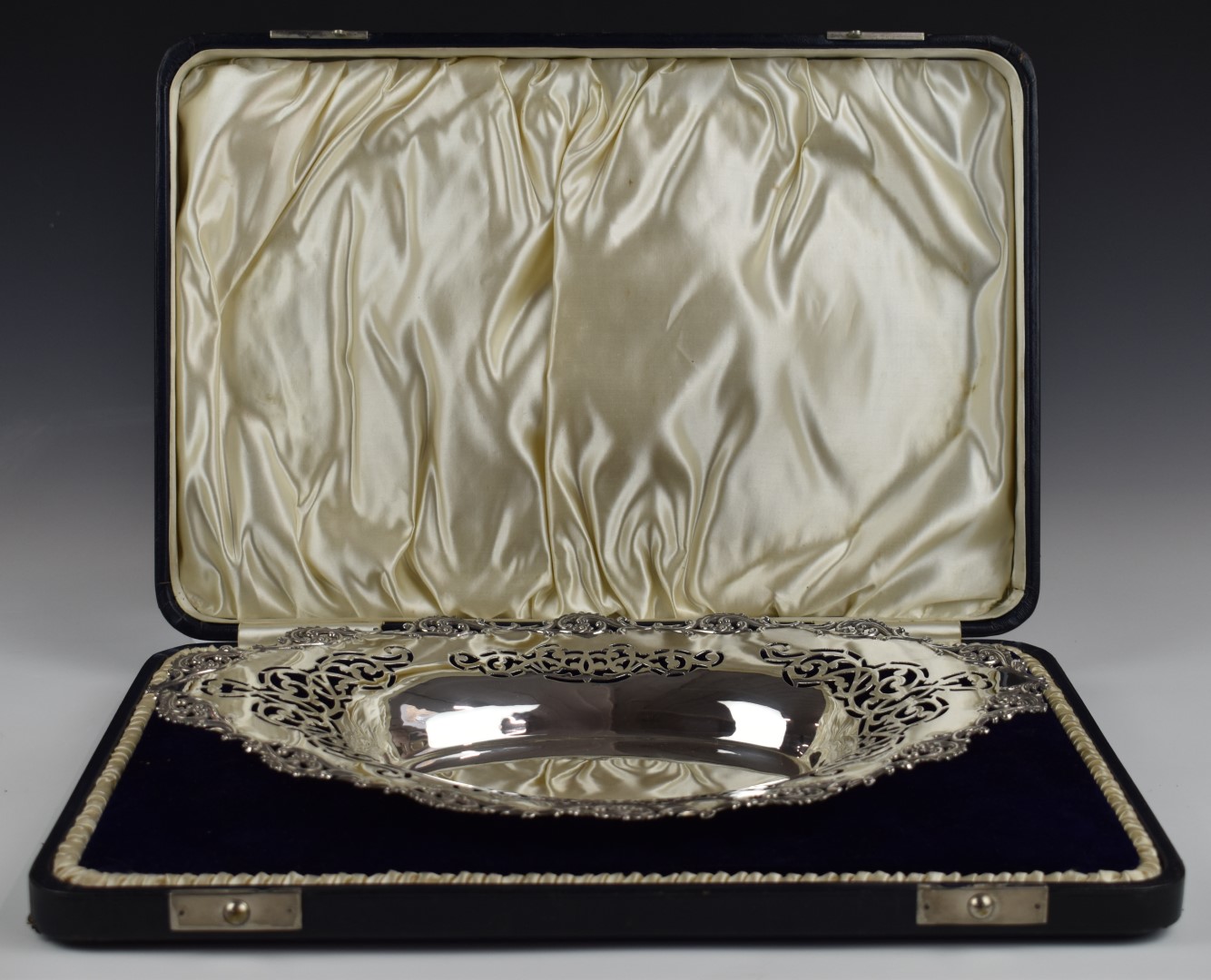 Edward VII cased hallmarked silver oval dish with pierced and embossed decoration, Chester 1901,