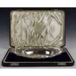 Edward VII cased hallmarked silver oval dish with pierced and embossed decoration, Chester 1901,