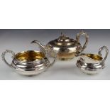 Georgian hallmarked silver three piece tea set of squat form with floral finial, length of teapot