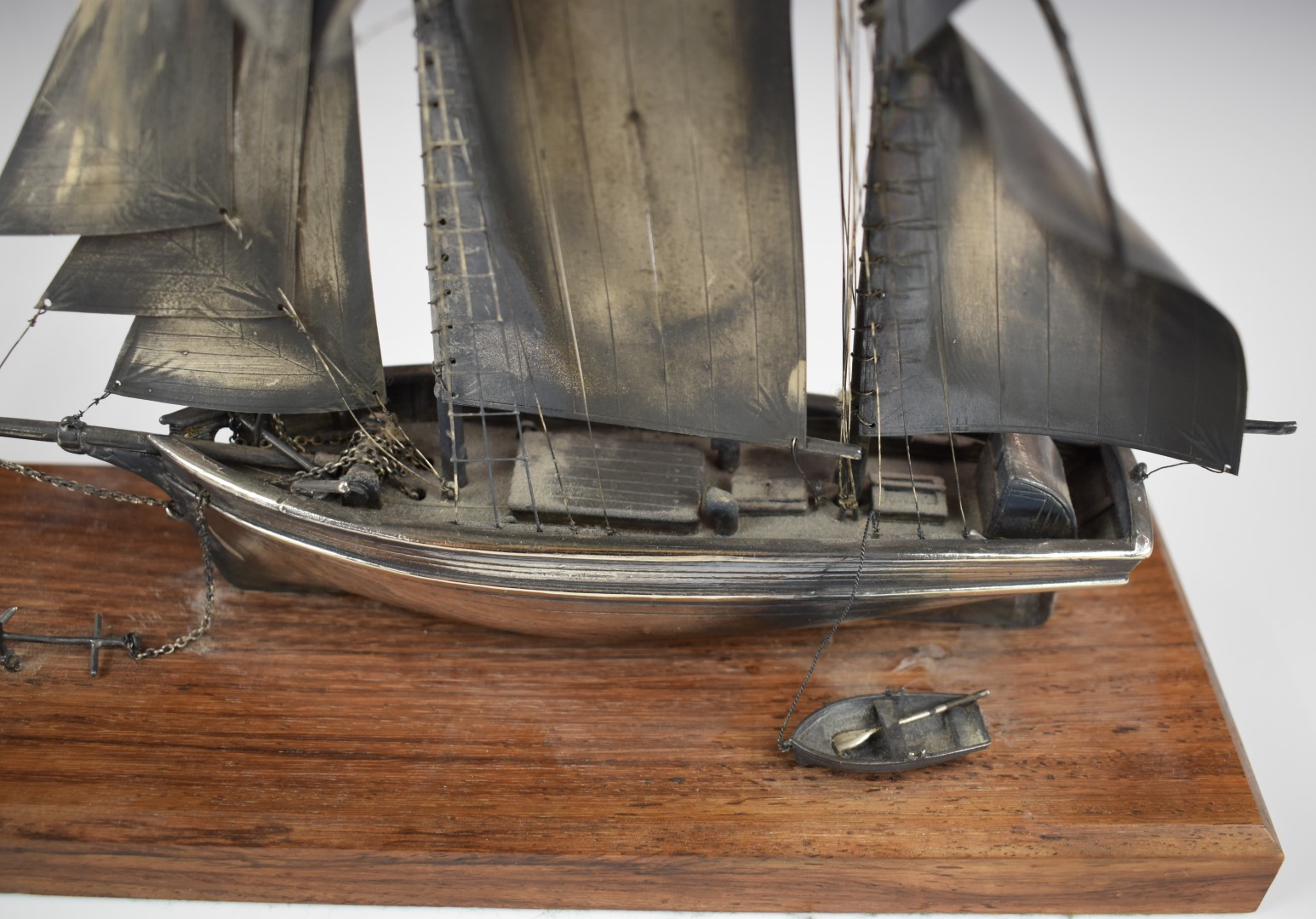 Hallmarked silver model of a sailing boat and tender, London 1980, maker Ammonite Ltd, on wooden - Image 2 of 6