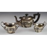 Edward VII hallmarked silver bachelor's three piece tea set with embossed decoration, Birmingham