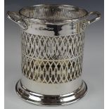 George V hallmarked silver twin handled wine bottle coaster or holder, with pierced lattice