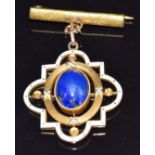 Victorian 9ct gold brooch set with a lapis lazuli cabochon and white enamel