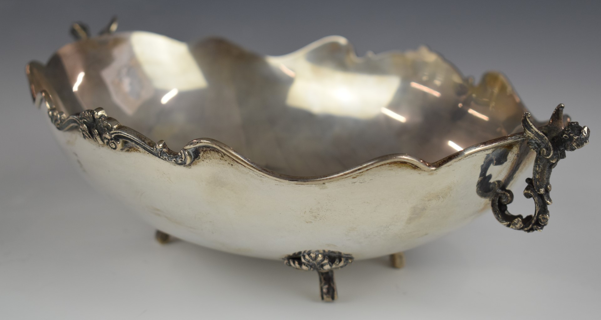 Continental white metal oval bowl with winged cherub handles, raised on four feet, marked 800 to - Image 2 of 3