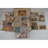 A collection of overseas banknotes in an album and sleeves, to include 1970 Congo Republic 50