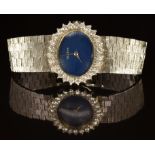 Swiss 14ct gold ladies wristwatch with silver hands, blue dial, diamond set bezel and 17 jewel