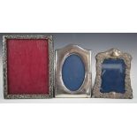 Three hallmarked silver photograph frames, the largest to suit 8 x 6 inch photo, Birmingham 1906,