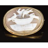 Victorian brooch set with a cameo depicting doves in a bird bath