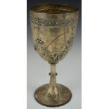 Victorian hallmarked silver trophy cup or goblet with embossed floral decoration and gilt wash