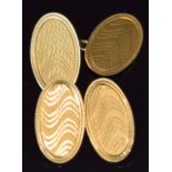 A pair of 18ct gold cufflinks with engine turned decoration, 6.1g