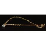 A 9ct gold stick pin set with a diamond, 1g