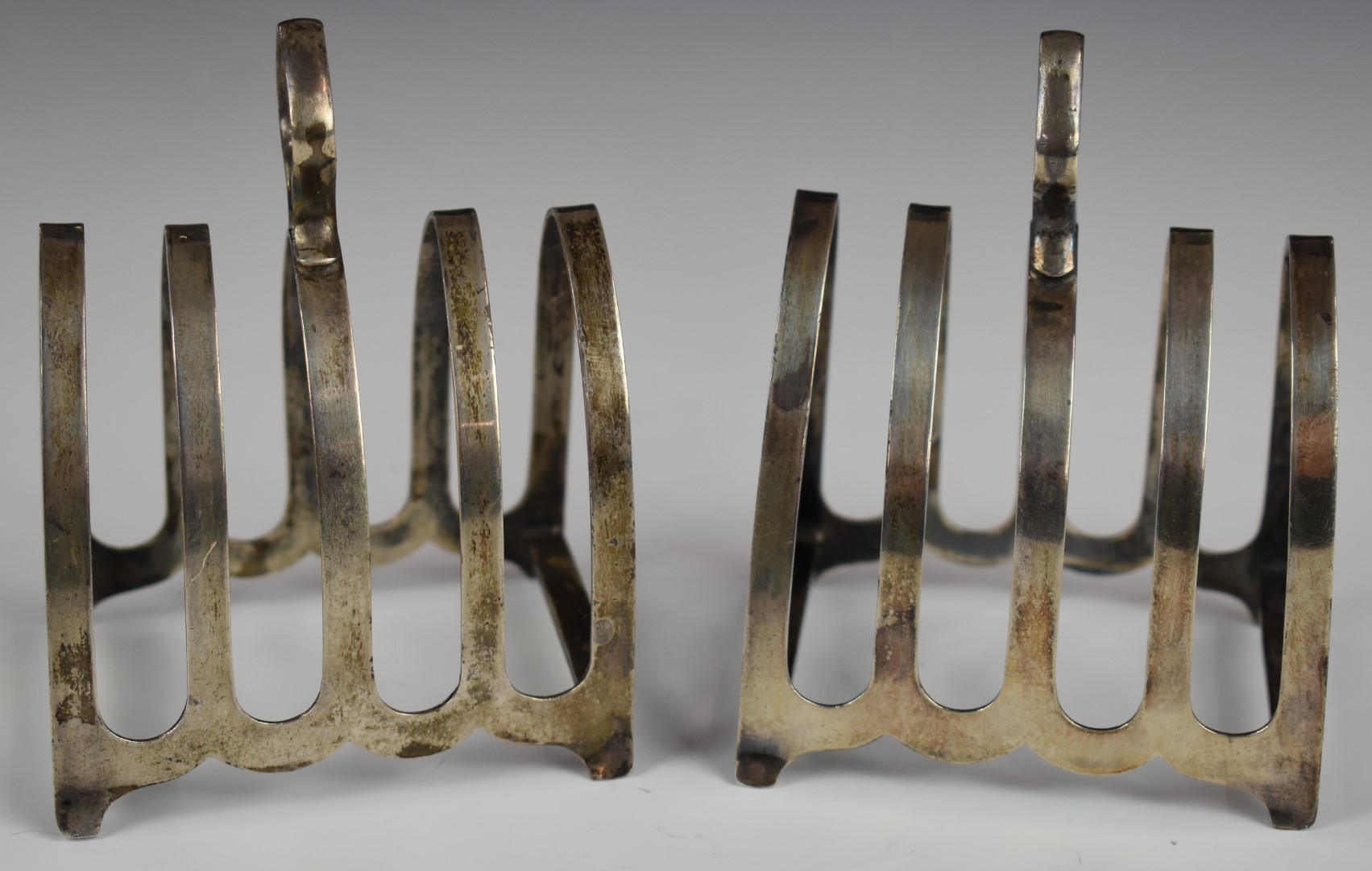 George VI pair of hallmarked silver five bar toast racks, Sheffield 1944, maker William Bush & Son