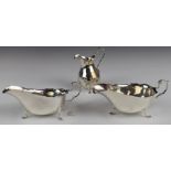 Edward VII pair of hallmarked silver sauce boats with scrolling handles, length 16cm, Birmingham