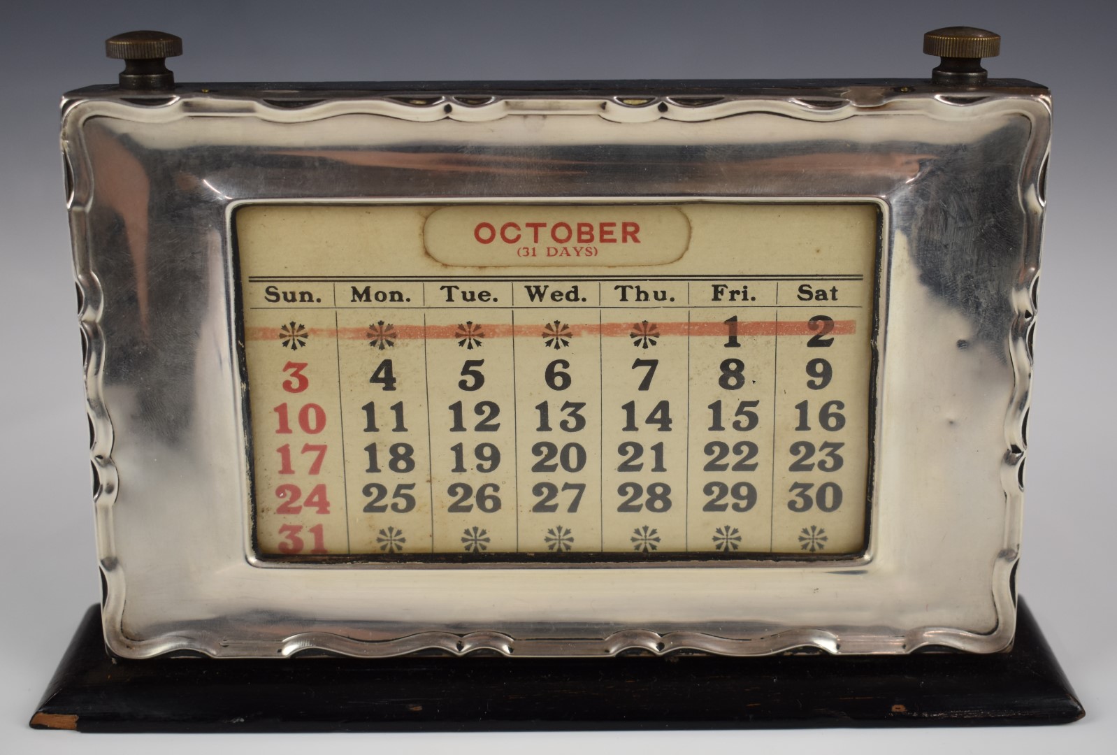 Hallmarked silver mounted perpetual calendar, Birmingham 1927, maker W J Myatt & Co, width 21cm