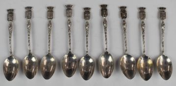 Nine French silver spoons, each with a town name and coat of arms finial, length 10.5cm, weight 65g