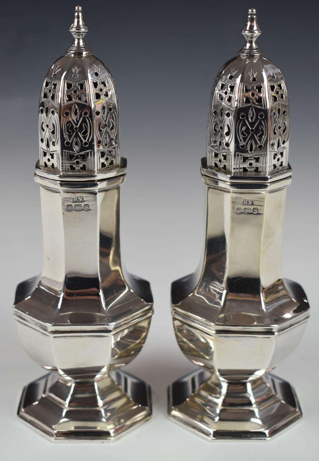 Pair of George V hallmarked silver sugar casters of octagonal baluster form, Sheffield 1935, maker