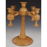 Arts and Crafts turned light oak four branch pedestal candelabra, diameter 32cm, H34cm