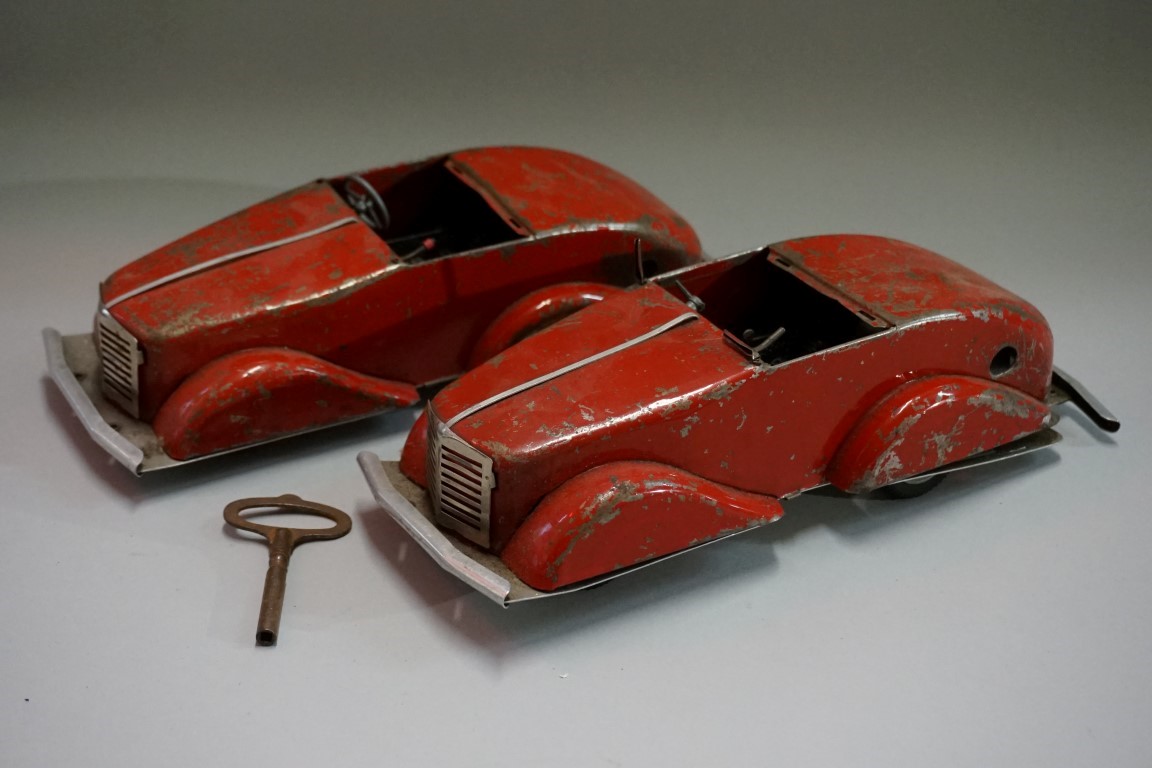 Two Louis Marx 'Toby Toys' tinplate clockwork four-speed streamline cars, 26.5cm long, (both a.
