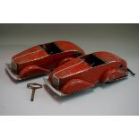 Two Louis Marx 'Toby Toys' tinplate clockwork four-speed streamline cars, 26.5cm long, (both a.