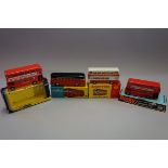 Three tinplate buses and a coach, comprising: Dinky 292 'Leyland Atlantean Bus', boxed; Dinky 295 '