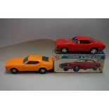 Two vintage tin plate battery operated cars, comprising: a Taiyo Chevrolet Camaro, boxed; and