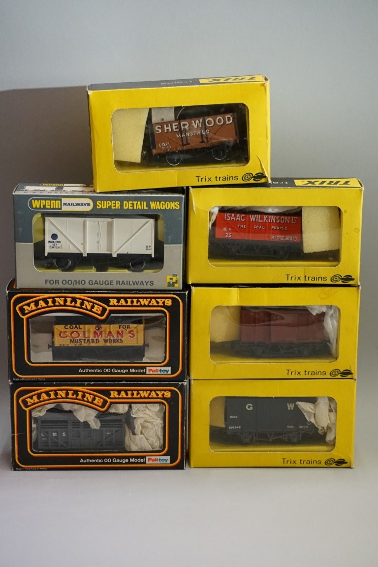 Seven boxed 'OO' gauge wagons, comprising: four Trix; two Mainline; and a Wrenn example. (7)