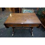 A reproduction inlaid mahogany sofa table, 91cm wide when closed, 145cm when open.Payment must be