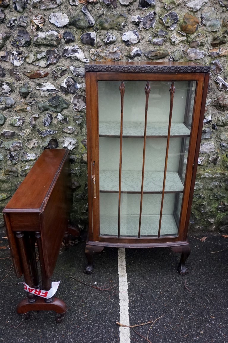 A 1960s mahogany bowfront display cabinet, 126cm high x 60cm wide; together with a reproduction