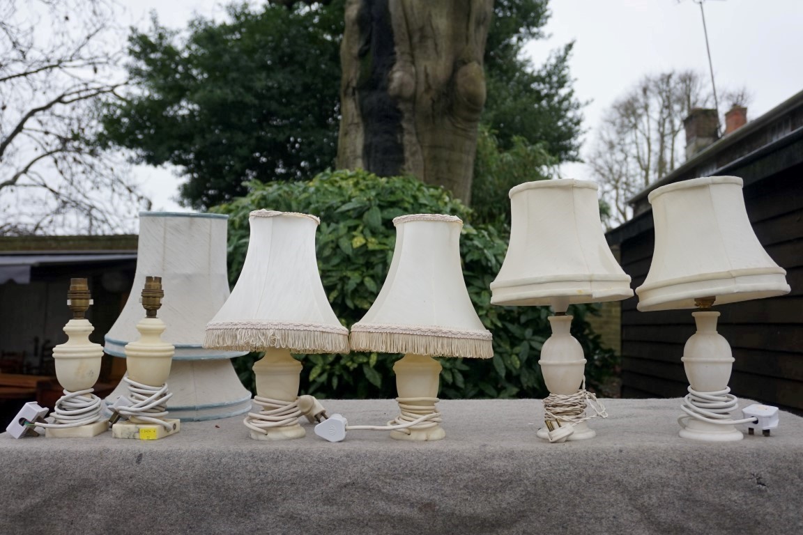 Three pairs of alabaster lamps.Payment must be made in advance of collection which is strictly by