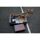 A quantity of shooting sticks, walking canes an electricity meter and an old wooden box.Payment must