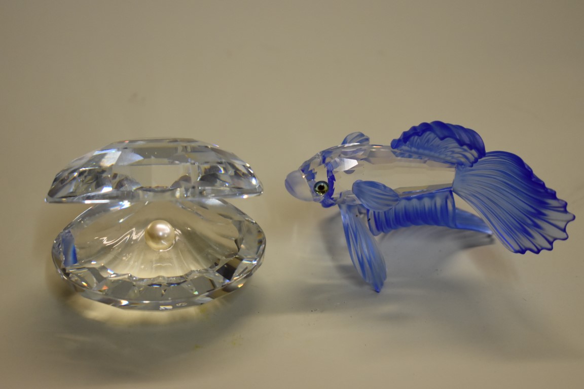 A Swarovski Siamese fighting fish, 8cm long; together with a similar oyster with pearl, 6.5cm