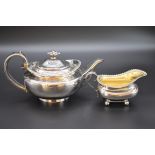 A George IV silver teapot, by Joseph Angell I, London 1825; together with a similar milk jug by